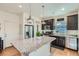 Kitchen boasting granite island, stainless steel appliances, and pantry at 249 S Old Hammer St, Aurora, CO 80018