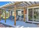 Relaxing patio with pergola, string lights, and seating area at 249 S Old Hammer St, Aurora, CO 80018