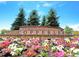 Copperleaf community entrance with a landscaped flowerbed at 22851 E Stanford Ln # A, Aurora, CO 80015