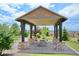 Relaxing community gazebo with picnic tables at 22851 E Stanford Ln # A, Aurora, CO 80015