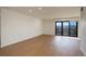 Bright living room with hardwood floors and access to a balcony at 460 S Marion Pkwy # 1353, Denver, CO 80209