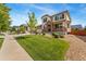 Two-story house with stone accents and landscaping at 5946 S Kellerman Ct, Aurora, CO 80016