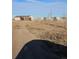 House with large yard and greenhouses in background at 41321 E 88Th Ave, Bennett, CO 80102