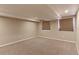 Finished basement with neutral walls and carpeted floors at 41321 E 88Th Ave, Bennett, CO 80102