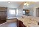 Elegant bathroom with double vanity, granite countertop, soaking tub, and walk-in shower at 41321 E 88Th Ave, Bennett, CO 80102