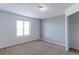 Well-lit bedroom with neutral walls, carpet, and a large closet at 41321 E 88Th Ave, Bennett, CO 80102
