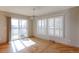 Bright dining area with hardwood floors and access to patio at 41321 E 88Th Ave, Bennett, CO 80102