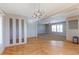 Open concept dining area with hardwood floors and living room view at 41321 E 88Th Ave, Bennett, CO 80102