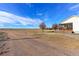 Ranch-style home with covered porch and expansive yard at 41321 E 88Th Ave, Bennett, CO 80102