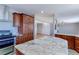 Spacious kitchen island with granite countertops and breakfast bar at 41321 E 88Th Ave, Bennett, CO 80102