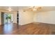 Bright living room with hardwood floors and sliding glass door to patio at 3349 S Monaco Pkwy # A, Denver, CO 80222