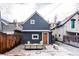 Cozy backyard patio with seating and a wooden fence at 2731 California St, Denver, CO 80205