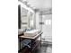 Large bathroom with double vanity and a soaking tub at 2731 California St, Denver, CO 80205