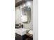 Bathroom boasts a modern vanity and a sleek mirror at 2731 California St, Denver, CO 80205