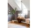Charming bedroom with wood bench and sloped ceilings at 2731 California St, Denver, CO 80205