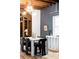 Modern dining area with white table and black chairs at 2731 California St, Denver, CO 80205