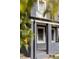 Charming two-story home with gray siding and small balcony at 2731 California St, Denver, CO 80205