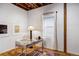 Bright home office features a window and wood floors at 2731 California St, Denver, CO 80205