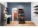 Modern kitchen features stainless steel appliances and light wood flooring at 2731 California St, Denver, CO 80205