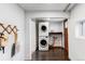 Basement laundry room with washer, dryer, and storage at 2731 California St, Denver, CO 80205