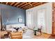 Spacious living room with modern furniture and large windows at 2731 California St, Denver, CO 80205