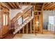 Exposed brick and wood staircase with modern railing at 2731 California St, Denver, CO 80205