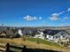 Community overview showcasing multiple homes with mountain views and solar panels at 1551 Bent Wedge Pt, Castle Rock, CO 80109