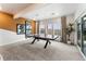Basement game room with ping pong table and ample natural light at 16655 W 93Rd Pl, Arvada, CO 80007