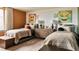 ' bedroom featuring two twin beds, playful artwork, and a dresser at 16655 W 93Rd Pl, Arvada, CO 80007