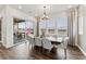 Dining room with wood floors and sliding glass doors leading to a deck at 16655 W 93Rd Pl, Arvada, CO 80007