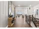 Welcoming entryway with wood floors and a view of the living area at 16655 W 93Rd Pl, Arvada, CO 80007