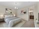 Spacious bedroom with ensuite bathroom and neutral decor at 323 Josef Cir, Fort Lupton, CO 80621