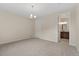 Large bedroom with plush carpeting and an adjacent bathroom at 323 Josef Cir, Fort Lupton, CO 80621