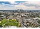 Aerial view showcasing the property's location near the city skyline at 2854 Eliot St, Denver, CO 80211