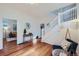 Living Room with hardwood floors, entryway view, and a stylish sitting area at 2854 Eliot St, Denver, CO 80211