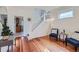 Bright living room with hardwood floors, staircase, and ample natural light at 2854 Eliot St, Denver, CO 80211