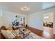 Spacious living room with hardwood floors, a cozy sitting area, and an open floor plan at 2854 Eliot St, Denver, CO 80211