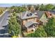 Brick house with gray roof, front porch, and landscaping, seen from above at 2854 Eliot St, Denver, CO 80211