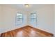 Spacious bedroom with hardwood floors and two large windows at 2854 Eliot St, Denver, CO 80211