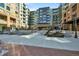 Modern building exterior with courtyard and seating areas at 20 N Wilcox St # 218, Castle Rock, CO 80104