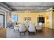 Spacious dining area with glass-top table and modern chandelier at 2100 16Th St # 606, Denver, CO 80202