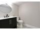 Basement bathroom features a vanity with a vessel sink and toilet at 3430 N Williams St, Denver, CO 80205