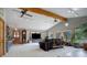 Spacious Gathering room with vaulted ceiling, exposed beams, and lots of natural light at 209 10Th Ave, Idaho Springs, CO 80452