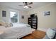 Comfortable bedroom with built-in shelving and hardwood floors at 209 10Th Ave, Idaho Springs, CO 80452