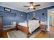 Spacious bedroom with hardwood floors and a large window at 209 10Th Ave, Idaho Springs, CO 80452