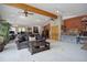 Spacious Gathering room with vaulted ceilings, exposed beams, and lots of natural light at 209 10Th Ave, Idaho Springs, CO 80452