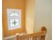 Stairwell with stained glass window and wooden railing at 209 10Th Ave, Idaho Springs, CO 80452
