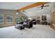 Spacious Gathering room with vaulted ceiling, exposed beams, and lots of natural light at 209 10Th Ave, Idaho Springs, CO 80452