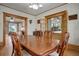 Bright dining room with hardwood floors and views into other rooms at 209 10Th Ave, Idaho Springs, CO 80452