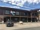 Exterior view of a single-story commercial building with parking at 209 10Th Ave, Idaho Springs, CO 80452